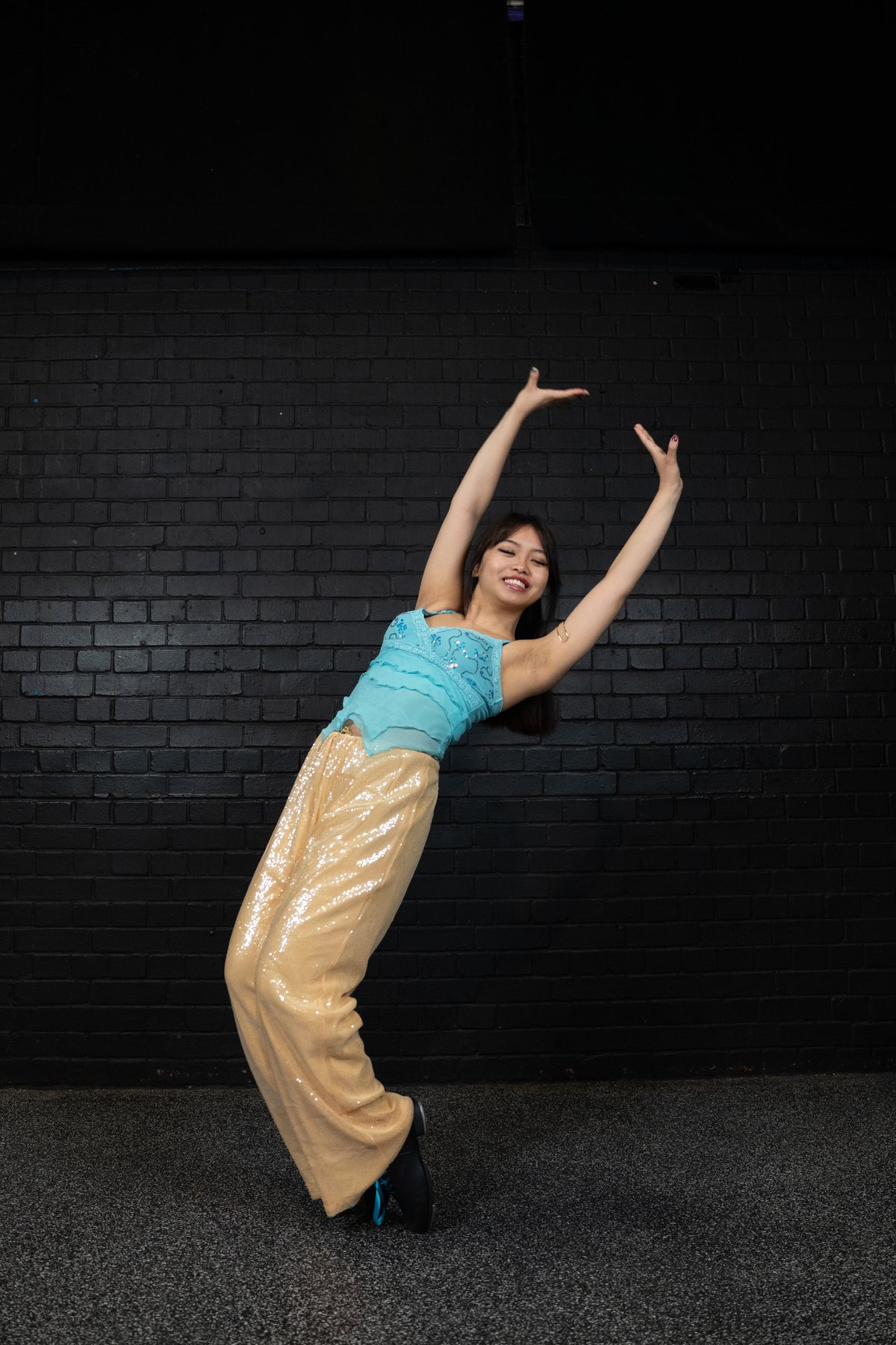 Solo dance portrait in a turquoise and gold costume