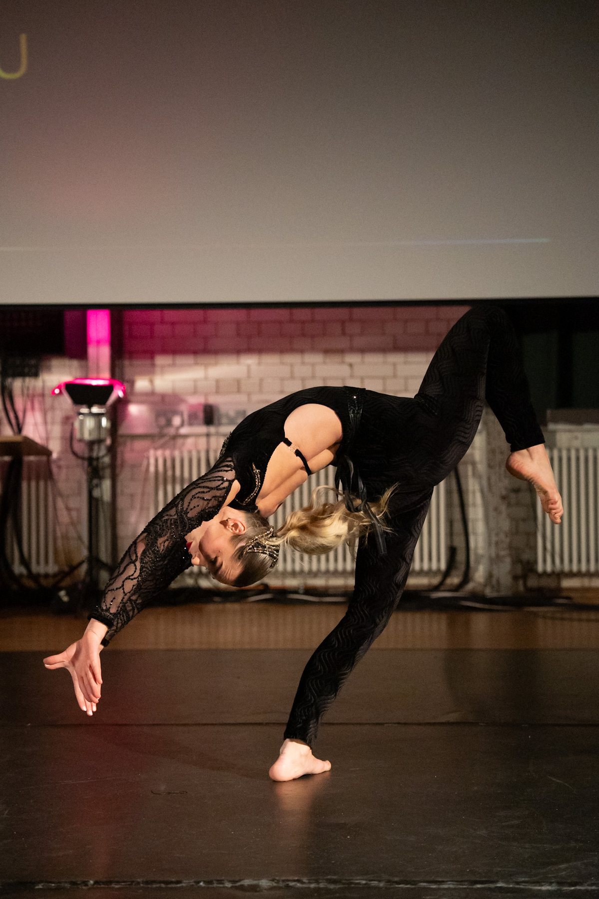 Dancer in a dramatic extended backbend
