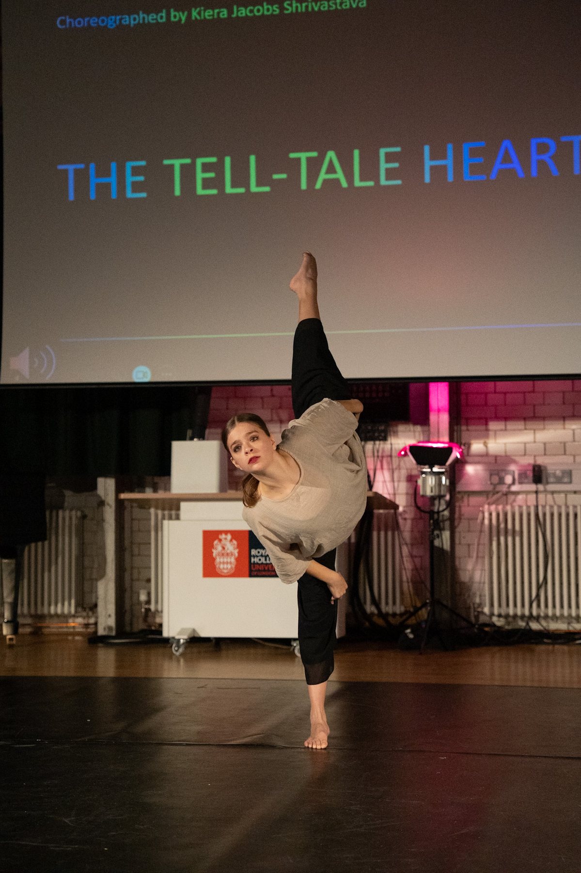 Dancer in a high extension arm balance