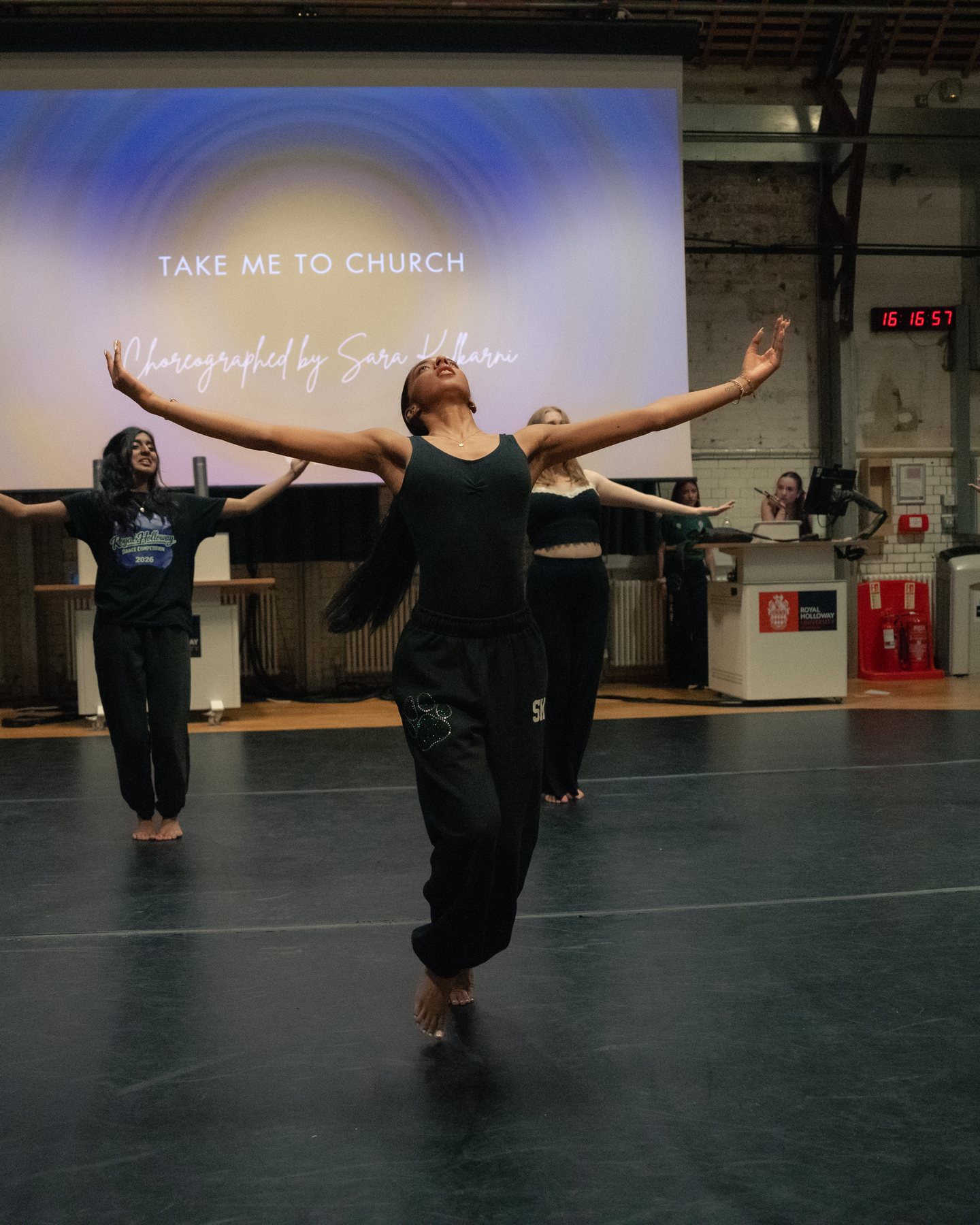 Solo dancer in a dramatic reaching pose