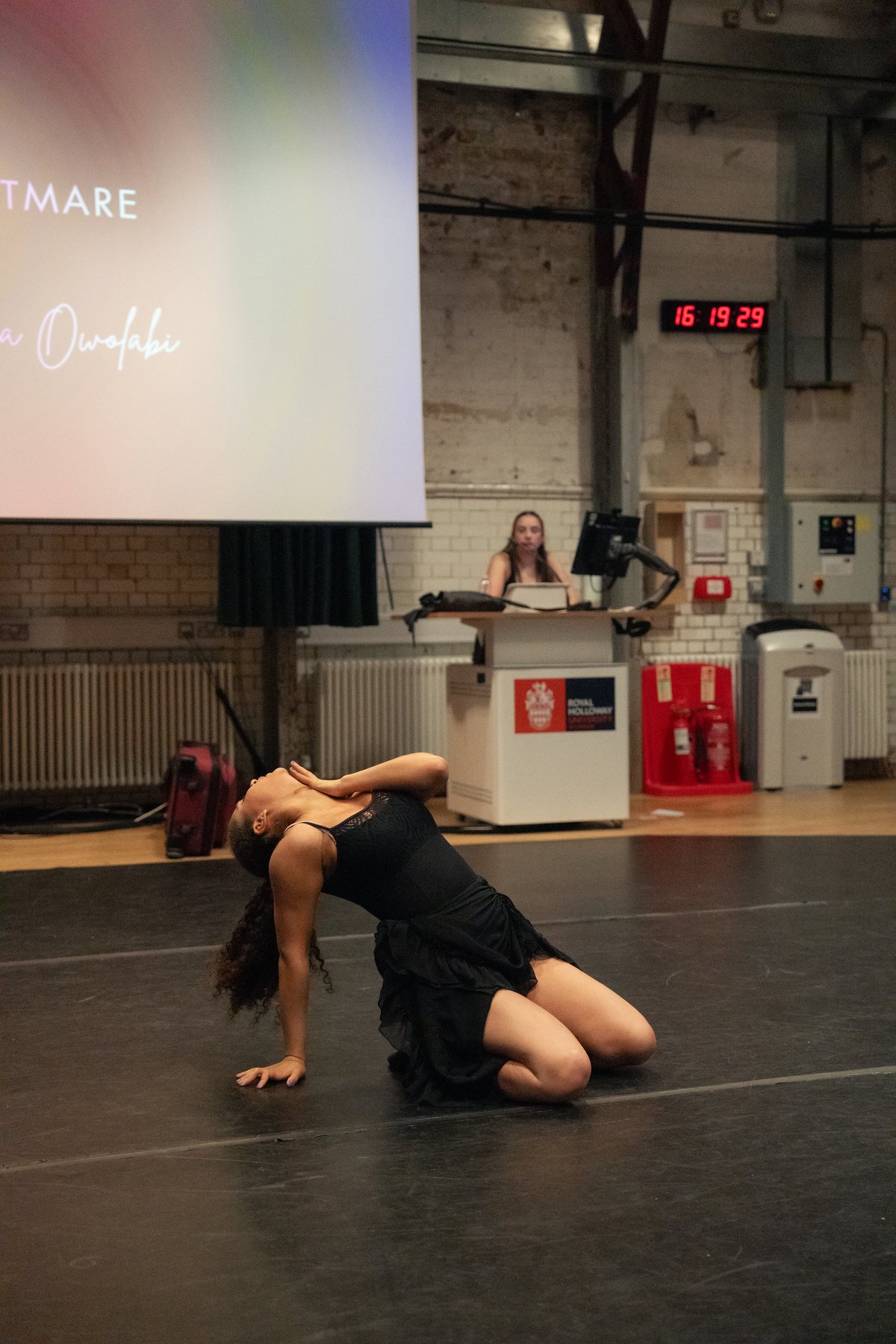 Dancer in a dramatic kneeling pose