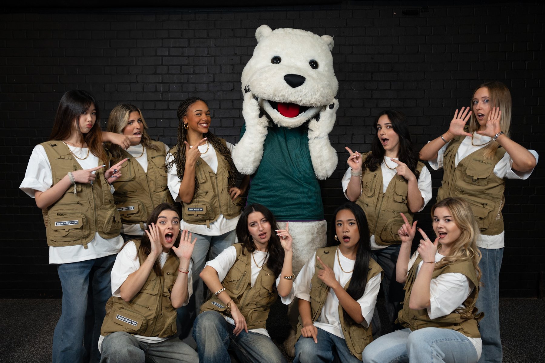 Large group photo with the university mascot